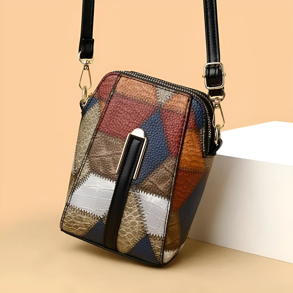 Soft PU shoulder bag with stitching detail, single strap, sandwich pocket, in irregular blue and black or blue and brown.