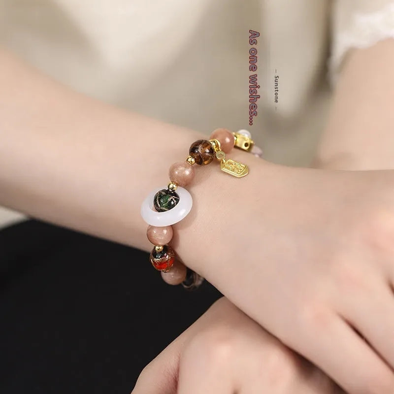 Hand-woven fragrant grey coloured glaze bracelet with sunstone and white lip shell beads