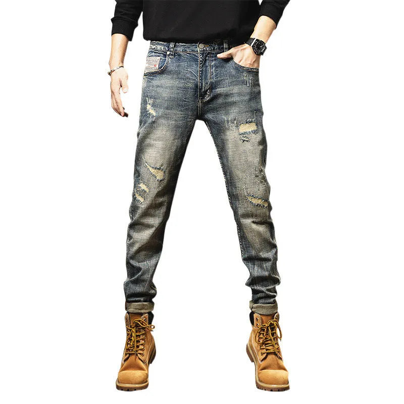 Man wearing vintage blue loose straight-leg jeans with a fleece lining and drawstring waist.