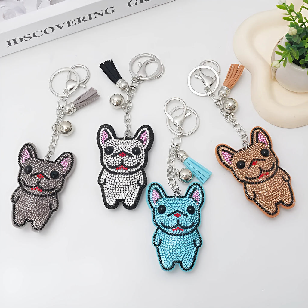 Close-up of a sparkling cartoon dog keychain pendant with rhinestones on an alloy base.