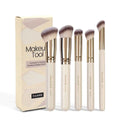 Apricot-coloured angled synthetic makeup brush from a five-piece MAANGE set for blush and powder application.