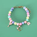 Resin pet headdress and necklace set in macaron colours on a cat or dog, showing moon and crown designs.