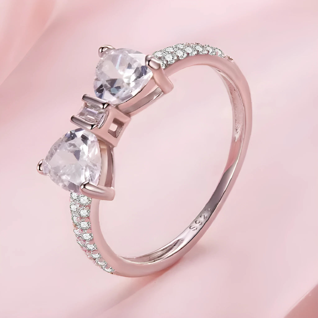 Sterling silver bow ring with zircon stone, available in sizes 6, 7, and 8, electroplated finish