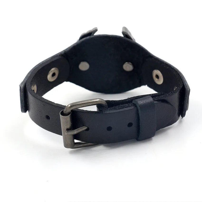 Black leather eagle geometric pattern bracelet with watch-button clasp on wrist