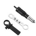 Black metal electric drill rivet gun adaptor with handle, wrench, and four rivet heads on a workbench.
