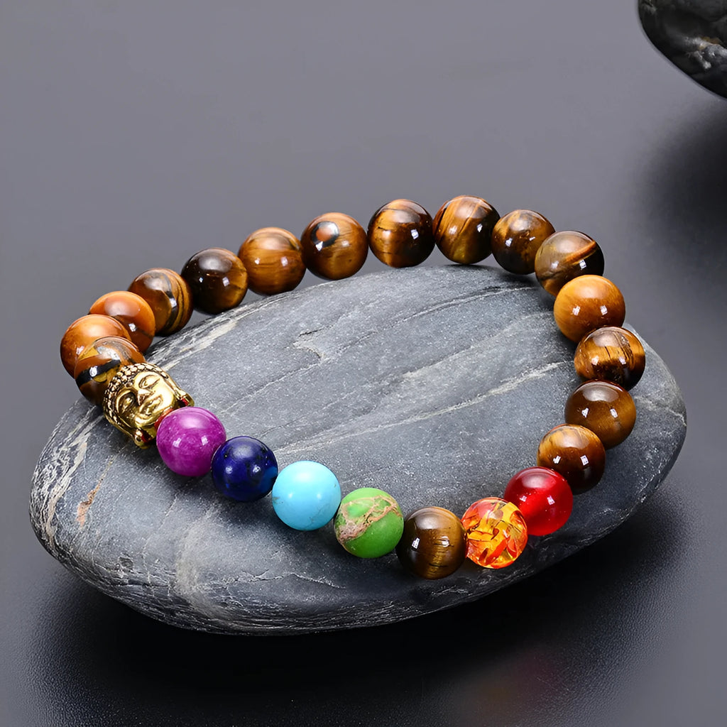 Seven chakra beaded bracelet with natural stone and tiger eye beads, adjustable rope, unisex design.