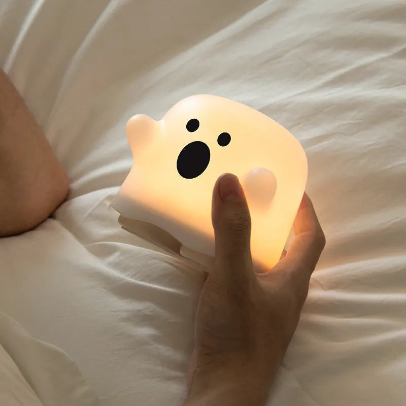 White silicone LED night light with touch sensor base and portable handheld design