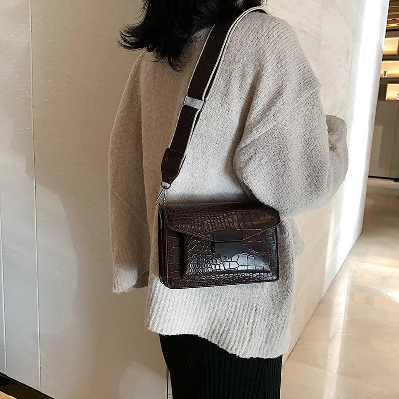 Vintage PU leather crossbody bag in black, shown with dimensions 20cm wide by 14cm high