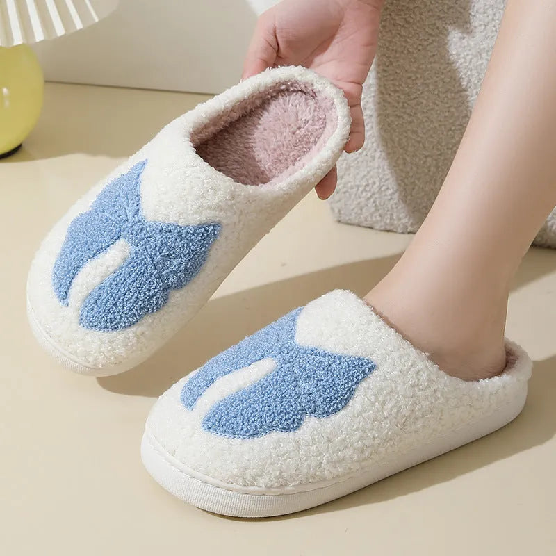 Cartoon bow knot cotton slippers in blue with suede upper and TPR sole.