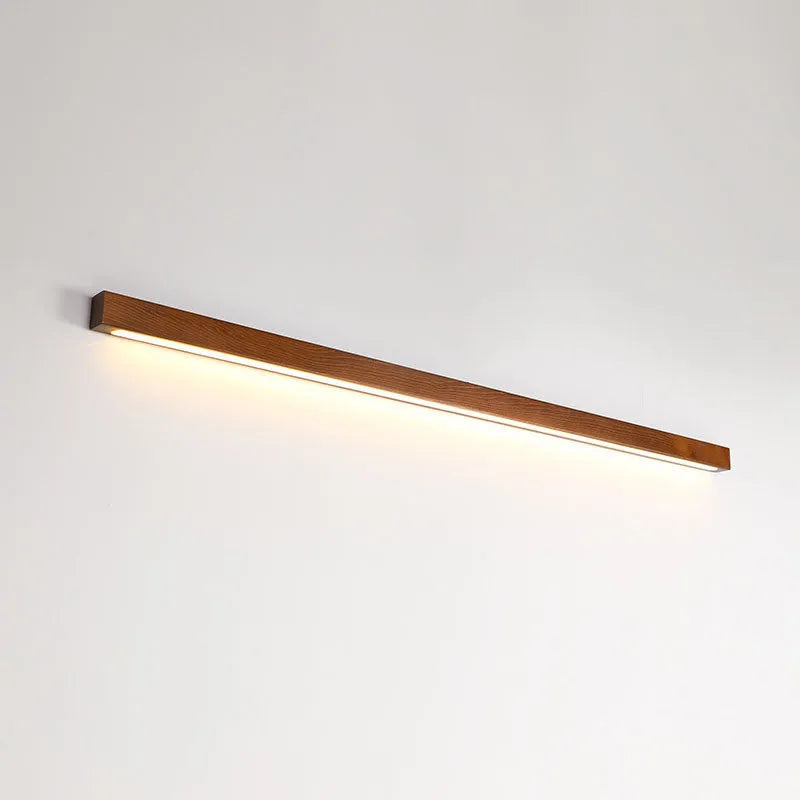 Walnut colour wood and acrylic log strip wall lamp in three lengths with integrated LED lighting