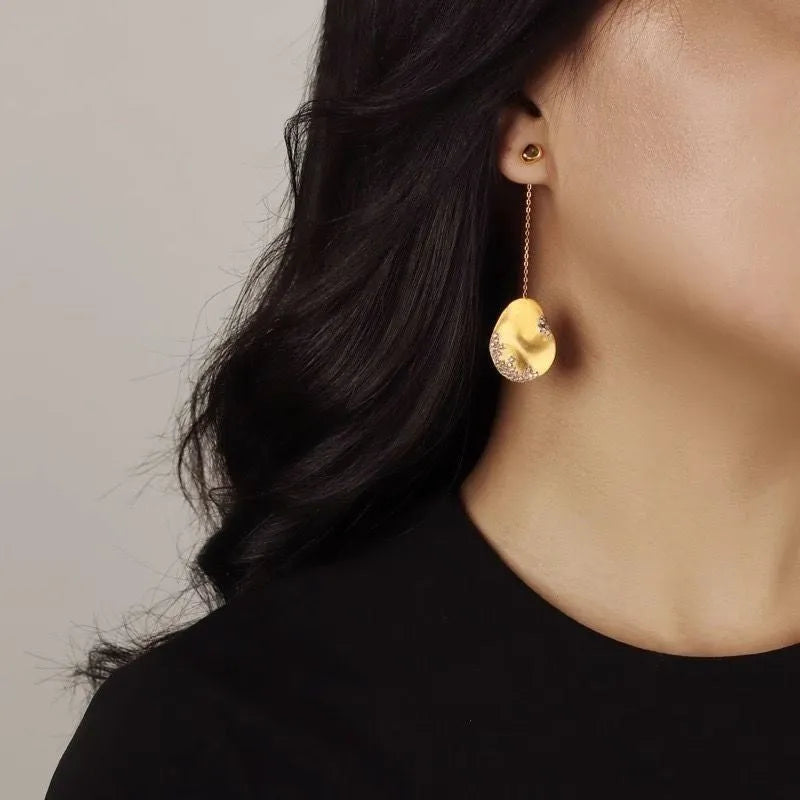 Asymmetric floral earrings with zircon stone detailing in gold-plated silver or gold finish