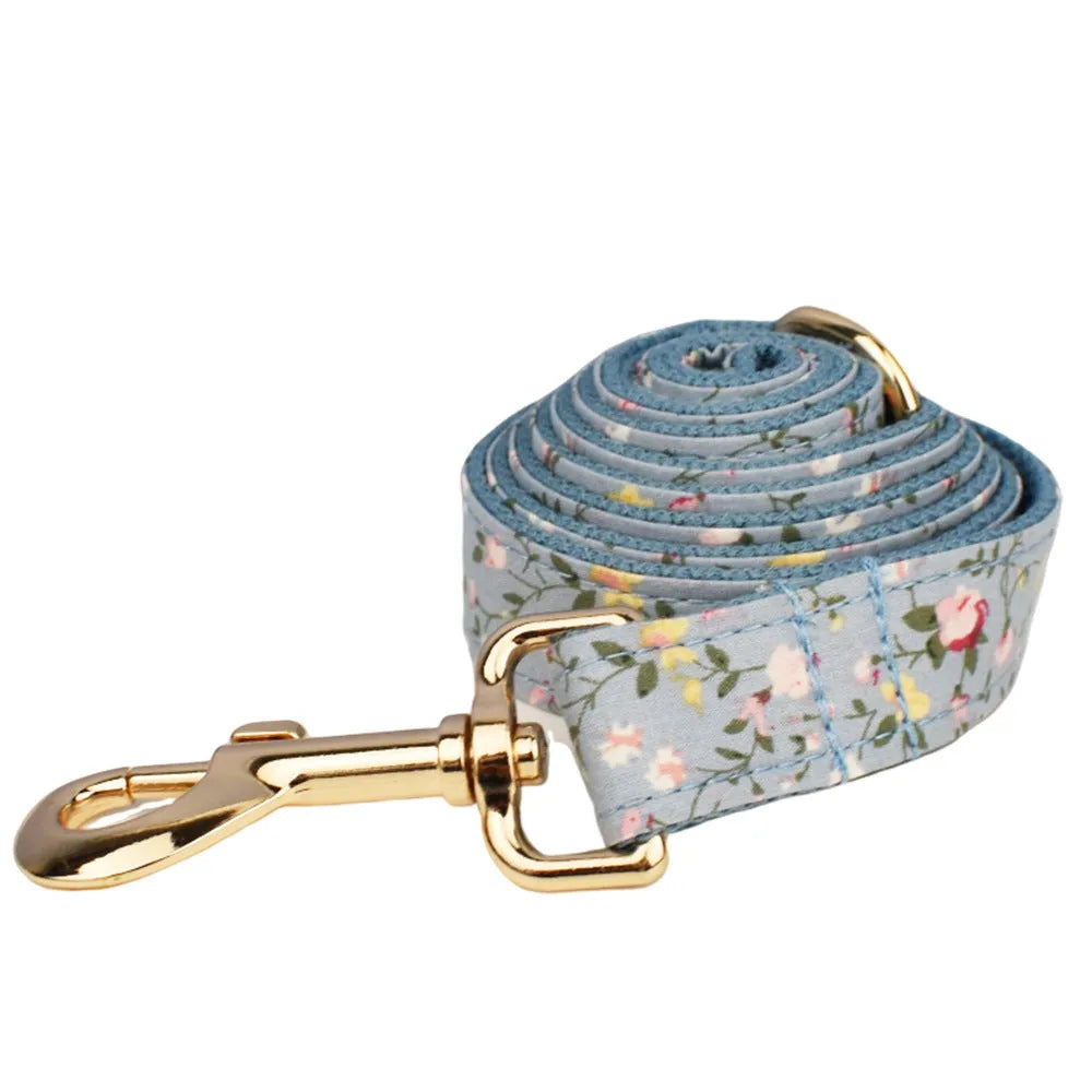 Blue floral polyester cotton dog collar with matching leash, vest, and bow tie accessories