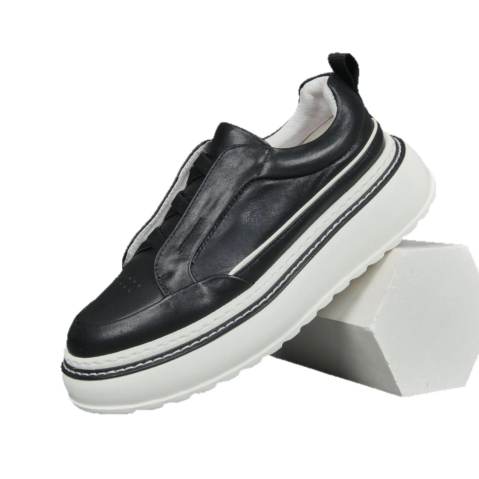 Women's black casual slip-on sneaker with cowhide upper, foam platform sole, round toe, and elastic band