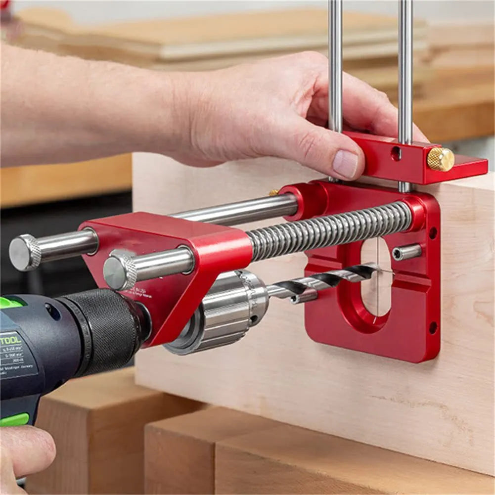 Woodworking drill locator with metal body and red or black plastic section for use on wood