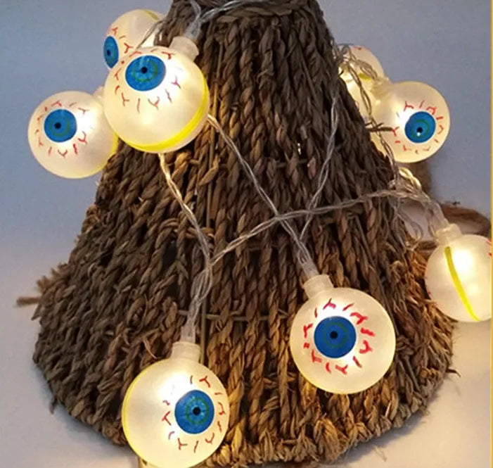 Halloween LED string lights with pumpkin, bat, and ghost pendants on a white wire