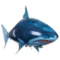 Large remote control shark inflatable balloon flying indoors with remote controller.