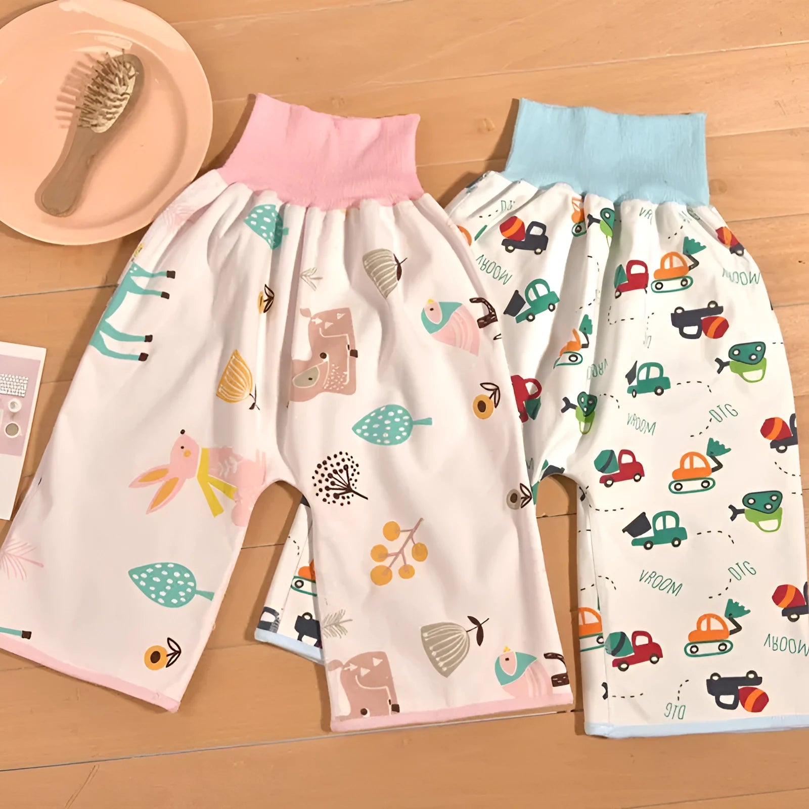 Baby diaper training pants in cotton with waterproof layer, high waist design with cartoon prints