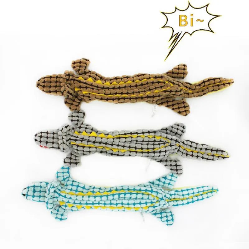 Blue crocodile-shaped plush squeaky dog toy shown beside coffee and grey colour options in small and large sizes