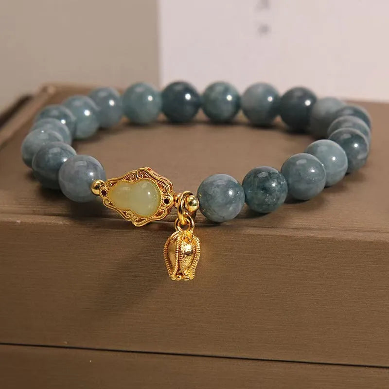 Sky blue natural stone gourd and lotus pendant bracelet for women with electroplated finish.