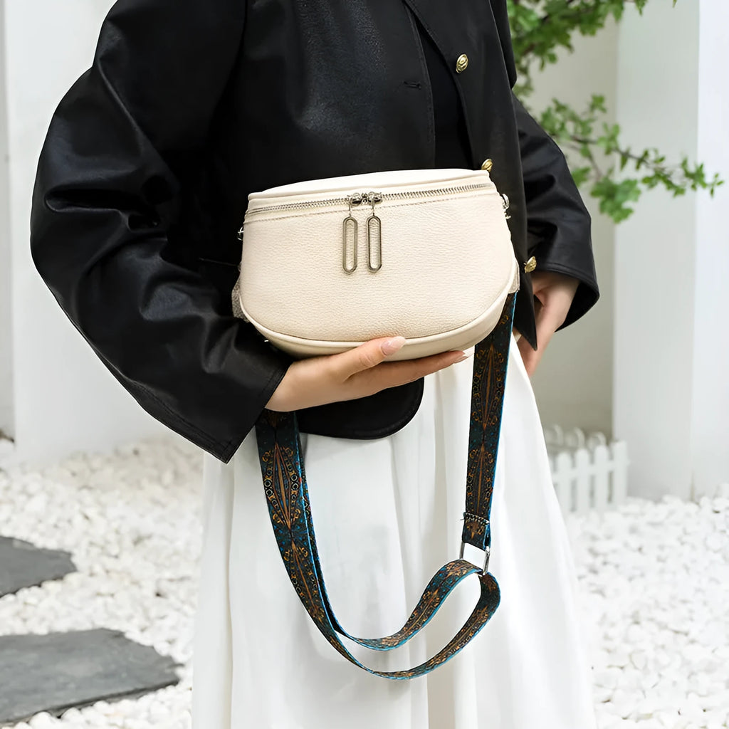 Women's saddle-shaped cattlehide leather messenger bag in crossbody style with single strap