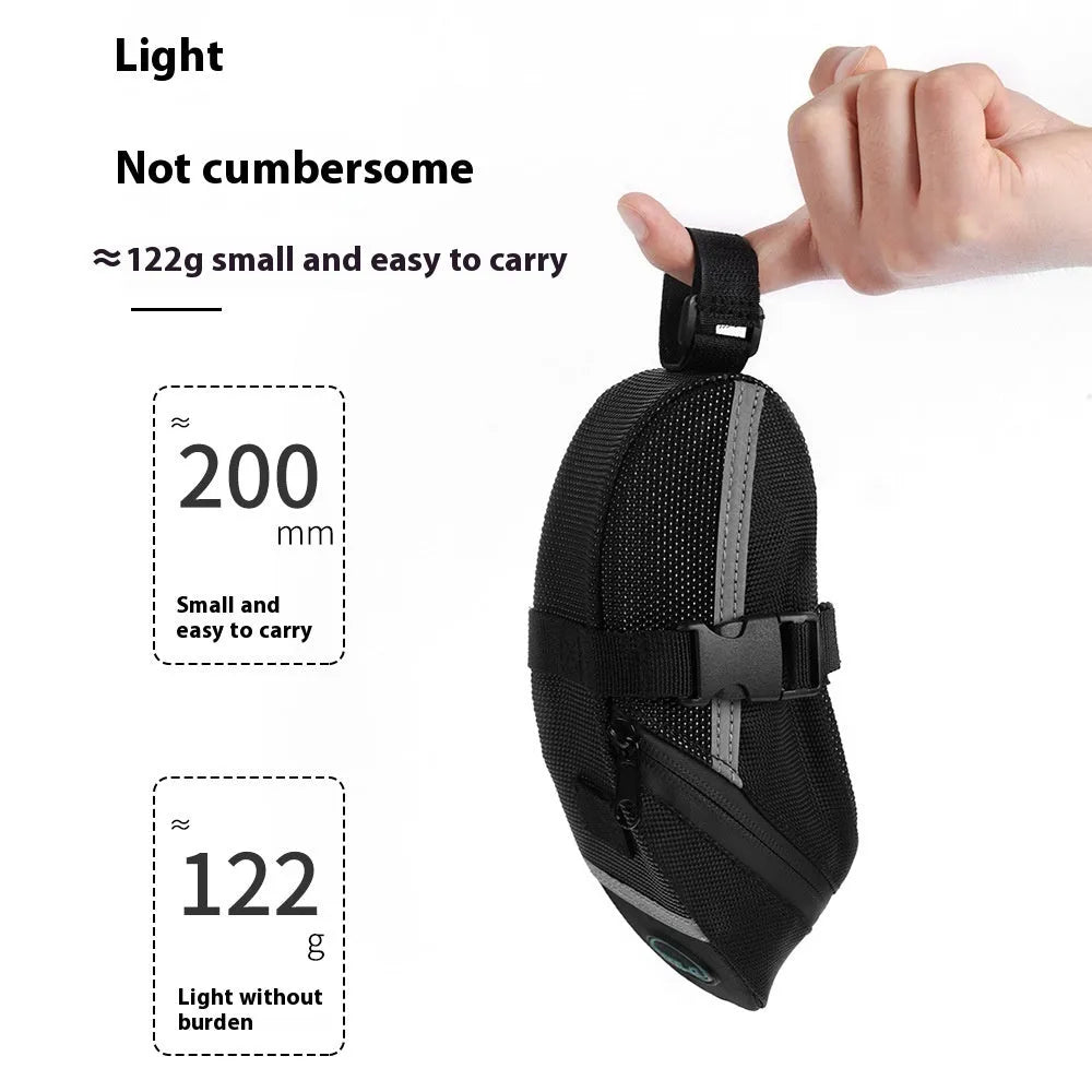 Black cycling tail bag mounted on mountain bike saddle with quick release fixture