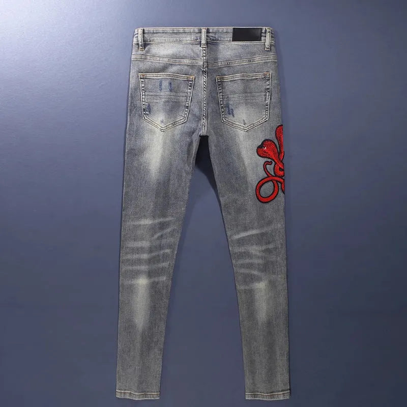 Men's slim fit distressed jeans with hole patches and embroidery in washed-out old colour
