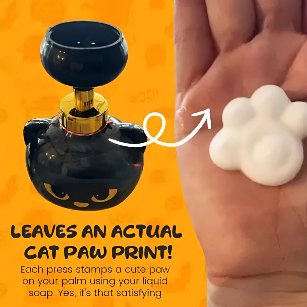 Black cartoon cat-shaped plastic foam soap dispenser on a wash basin.