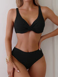 Women's solid colour rib fabric bikini set in black, green, or blue.