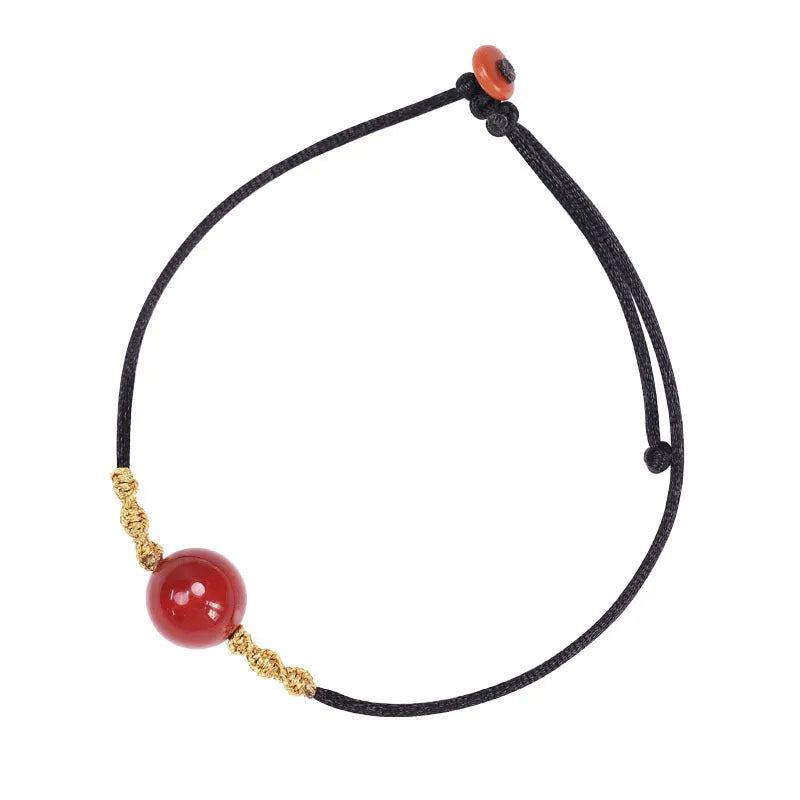 Hand-woven red agate bracelet and necklace set for women in a national style with bead details.