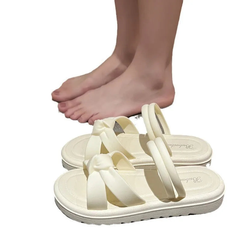 Women's black outdoor sandals with thick soft back and flower detailing on PVC upper