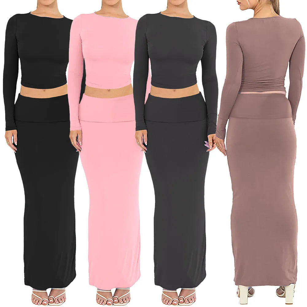 Women's black sweet style two-piece suit with three-quarter sleeve top and long skirt.