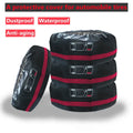 Set of four black Oxford cloth tyre protective covers with red belt closures laid flat.
