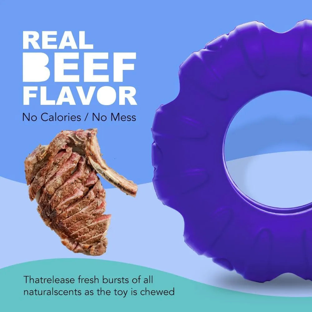Blue rubber tyre-shaped dog chew toy with oval openings for slow feeding.