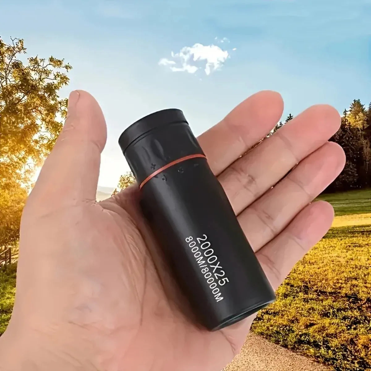 Black monocular telescope with rubber grip and attached mobile phone holder for outdoor observation