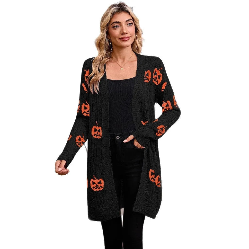 Women's black cardigan with orange pumpkin head jacquard knit pattern on the front.