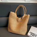 Women's large capacity straw bag in beige with canvas lining and double shoulder straps