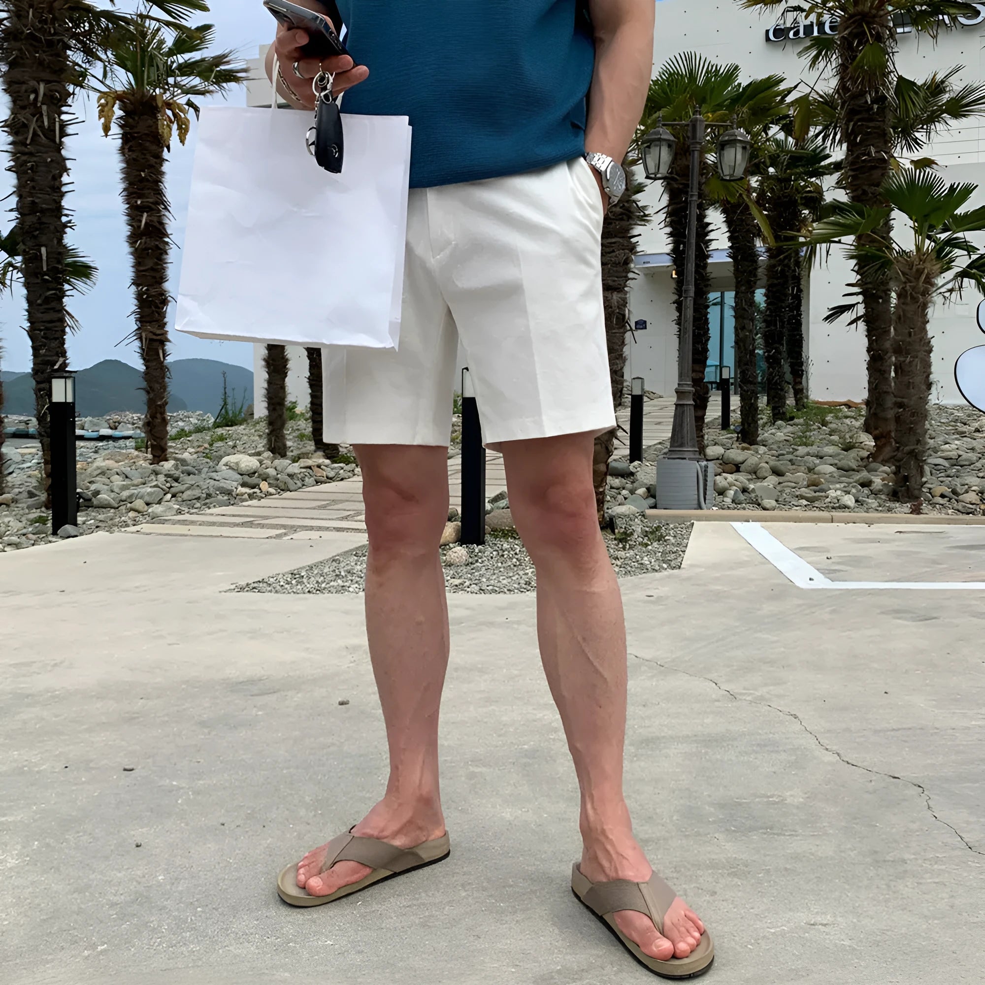 Men's loose straight casual shorts in black, white, and khaki solid colours made from polyester fabric