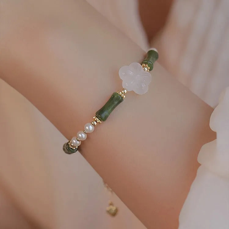 Chinese style women's bracelet with Hetian jade, bamboo joint design, and 4mm shell pearl components