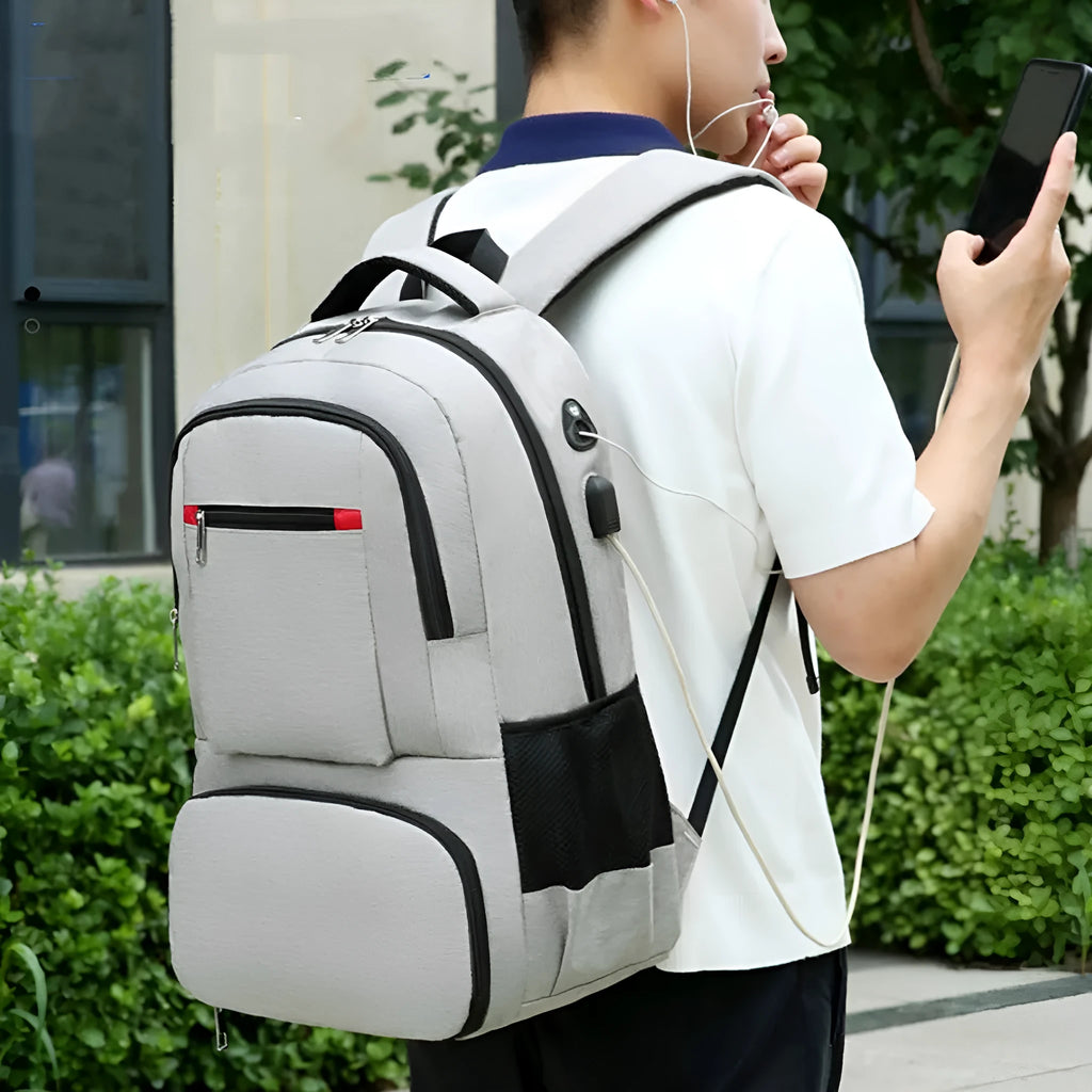 Light grey insulated Oxford cloth backpack with curved shoulder straps and wet-dry separation compartments.