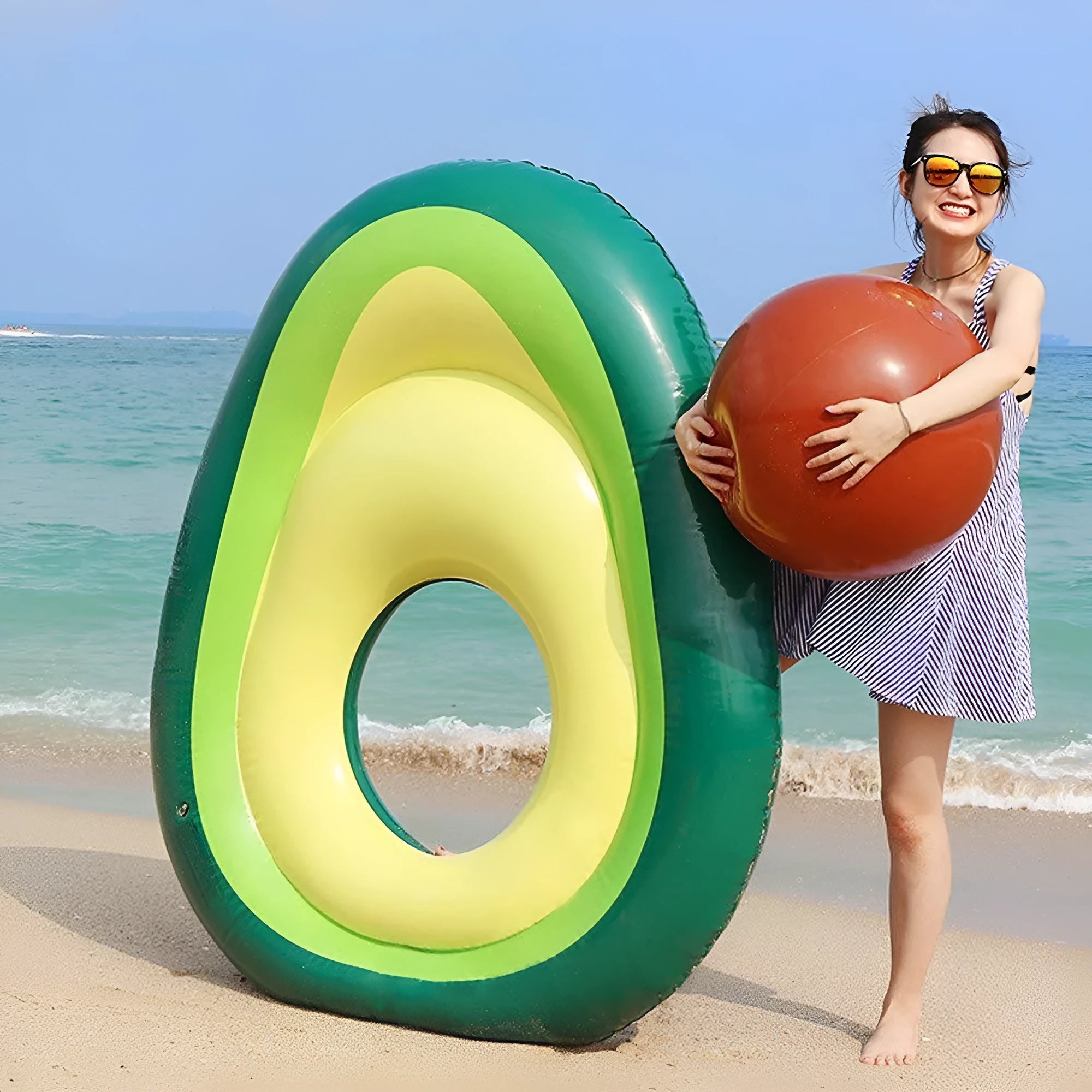 Large green inflatable avocado-shaped pool float measuring 169cm long