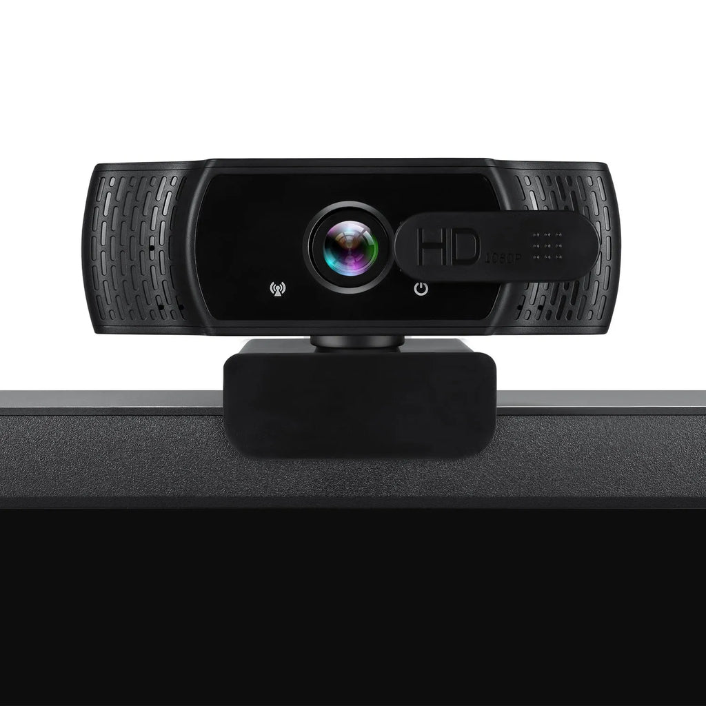Black USB webcam with built-in microphone mounted on a laptop screen