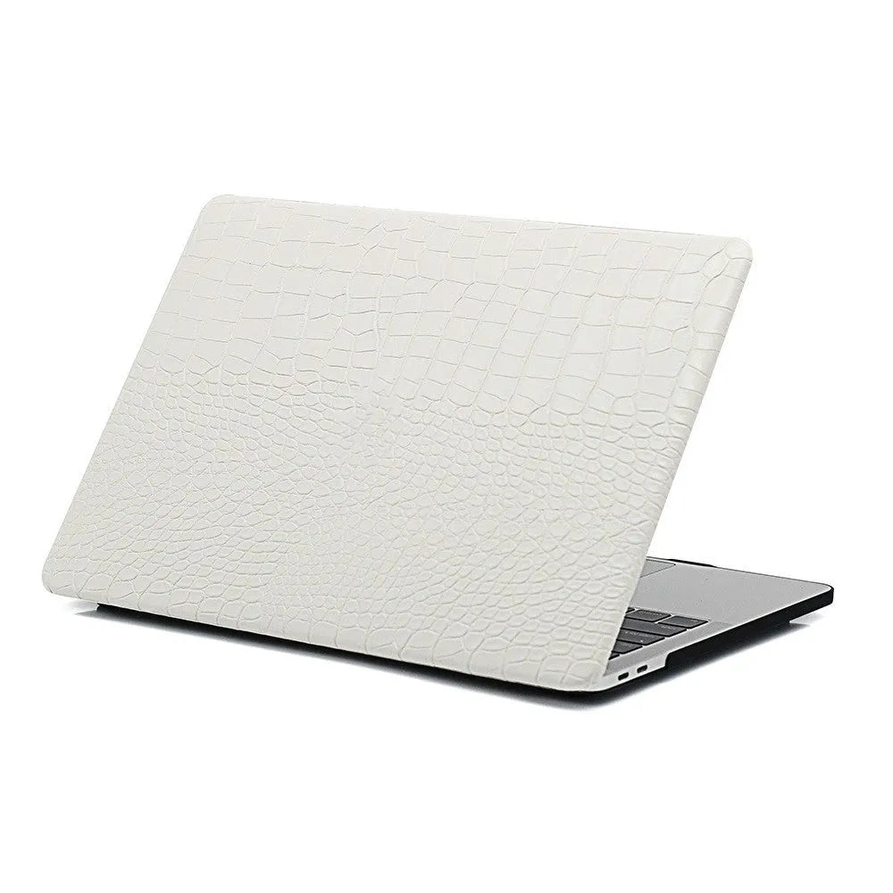 Black MacBook protective case with crocodile texture and visible Apple logo through a cutout.
