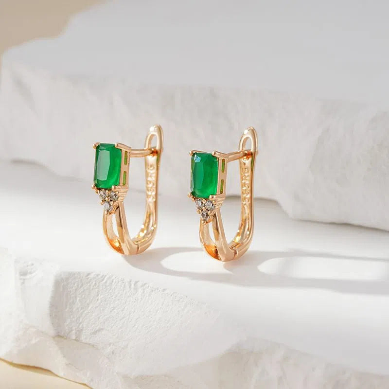 Rose gold tone square stud earrings with green zircon detail, copper piercing material, one pair