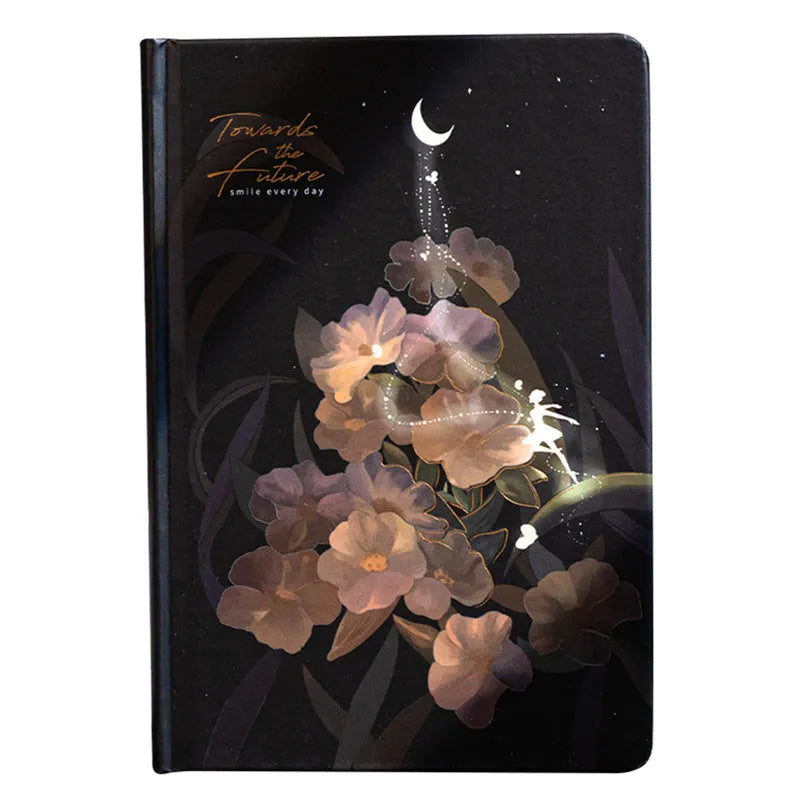 A5 notebook with luminous cover open to show colour illustrated interior pages