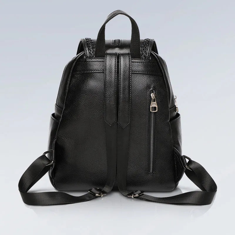 Solid colour genuine leather women's backpack showing internal organisation compartments