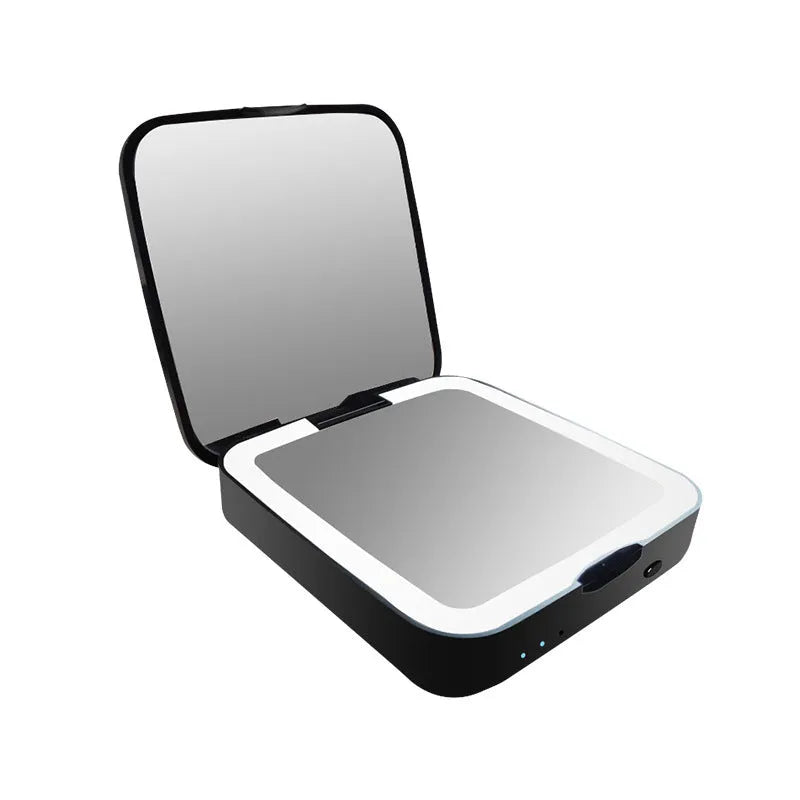 Black and white illuminated vanity mirror showing 4x magnification side and adjustable LED light settings.