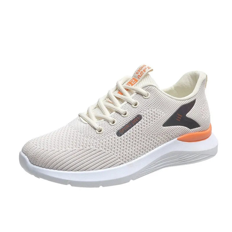 Women's low top casual running shoes in beige with mesh upper, lace-up front, round toe, and soft PVC sole