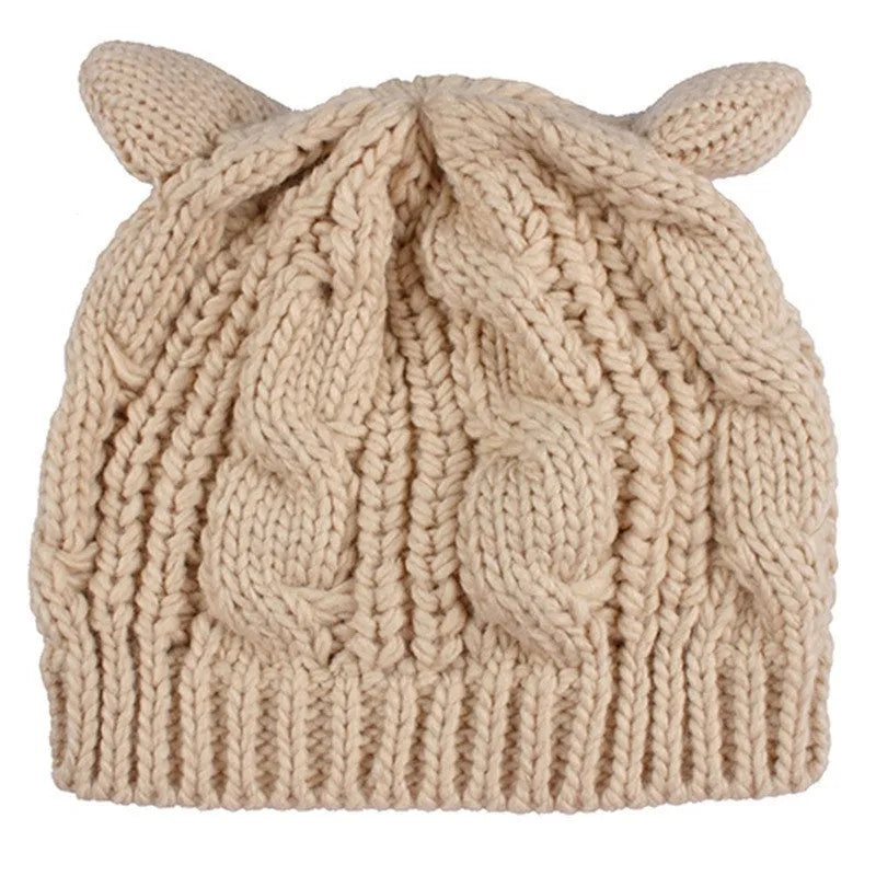 Hand-made 3D knitted cat ear beanie with pom-pom in wool, showing red colour option