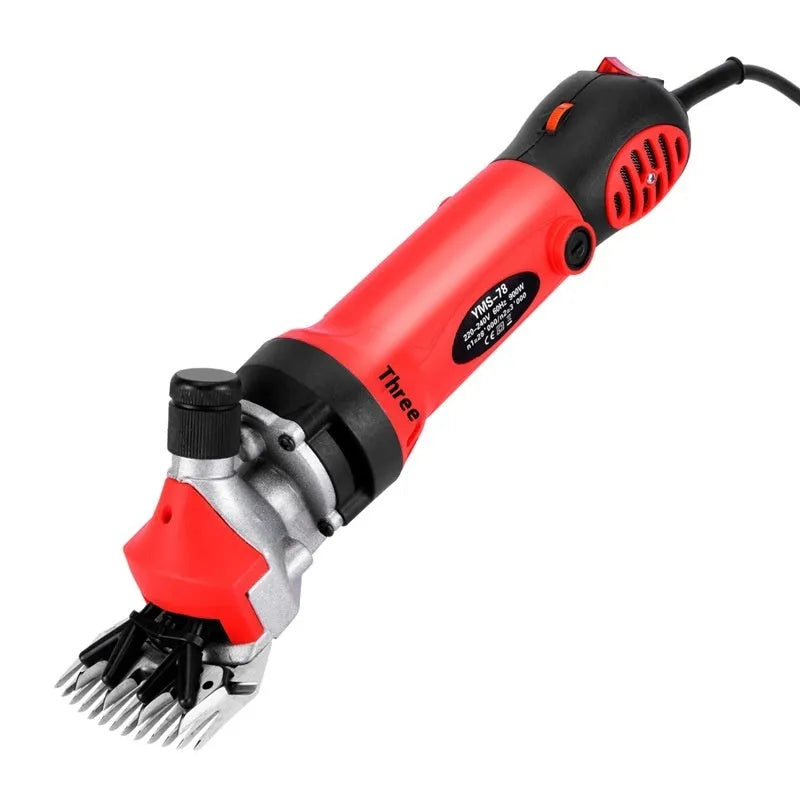 Yellow electric wool shearing machine with 13-tooth straight blade and accessory kit including multiple blades and maintenance tools