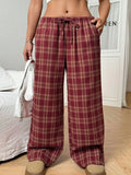 Women's plaid trousers with drawstring waist and multiple pockets in blue or red colours